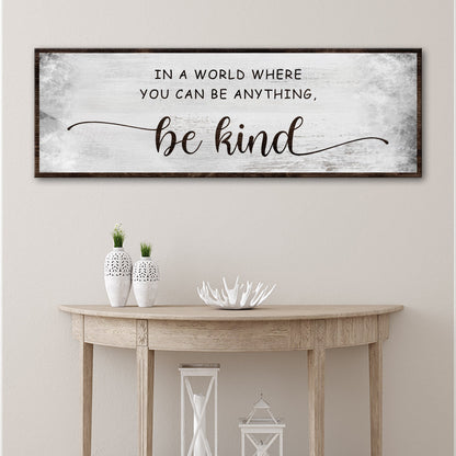 Tailored Canvases be kind canvas sign with distressed white background and dark wood frame on Tampa Home & Garden Store