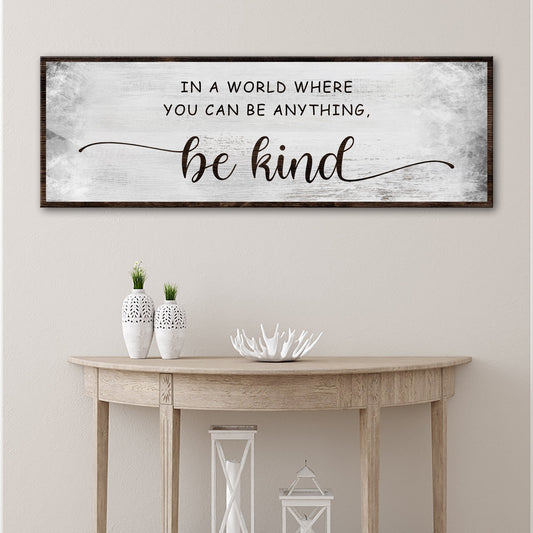 Tailored Canvases be kind canvas sign with distressed white background and dark wood frame on Tampa Home & Garden Store