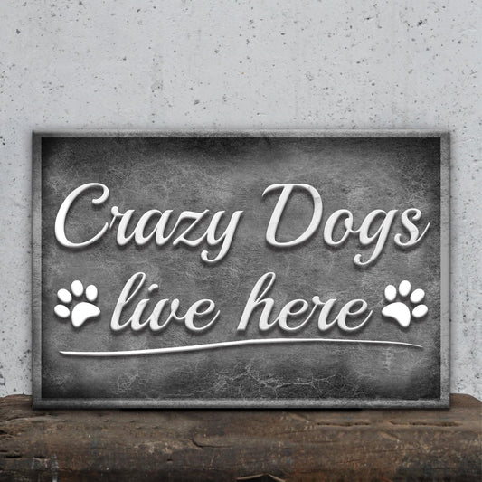 Crazy Dogs Live Here Sign II canvas with white cursive text on a dark plaque and paw prints on Tampa Home & Garden Store