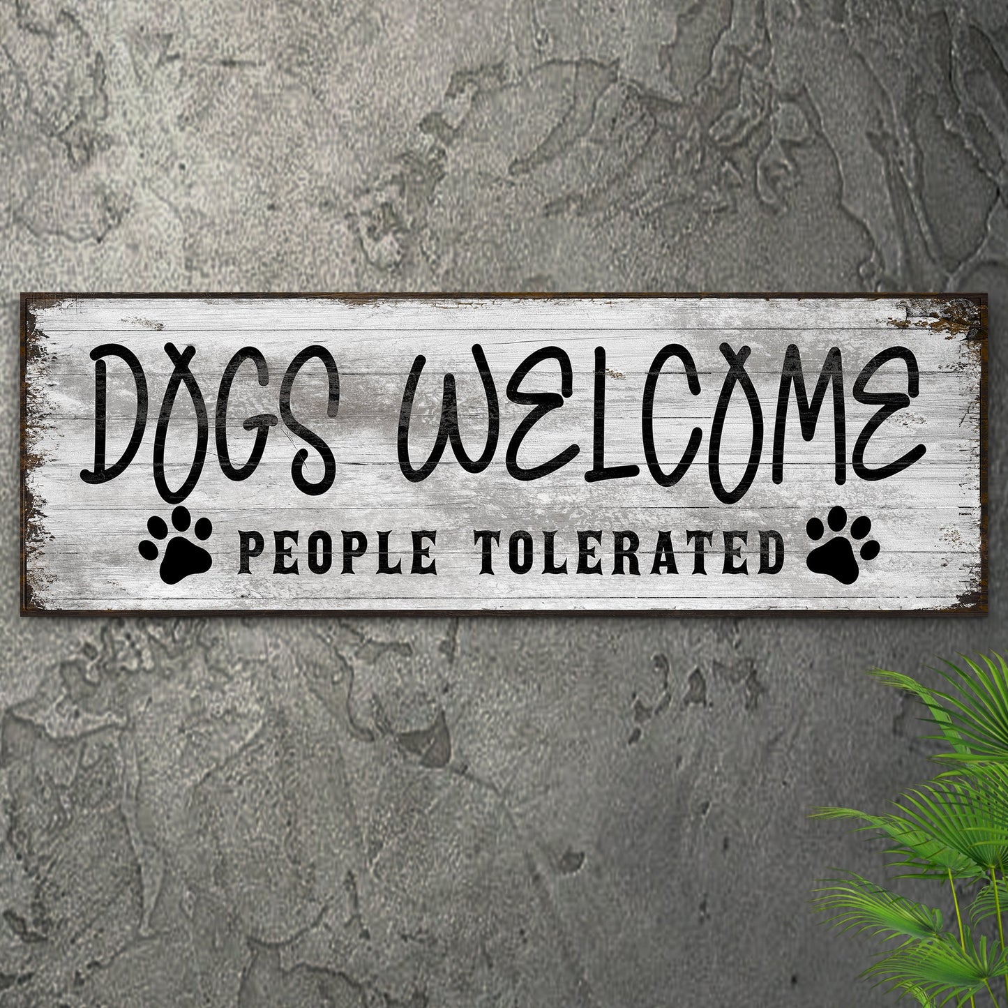 Canvas sign Dogs Welcome People Tolerated with paw prints on distressed wood backdrop on Tampa Home & Garden Store