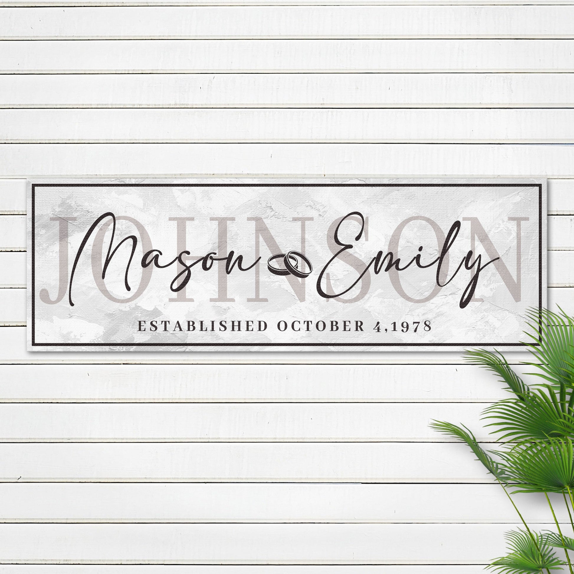 Last Name Wedding Gift Sign canvas with elegant script names on light marble backdrop on Tampa Home & Garden Store