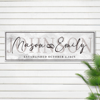 Last Name Wedding Gift Sign canvas with elegant script names on light marble backdrop on Tampa Home & Garden Store