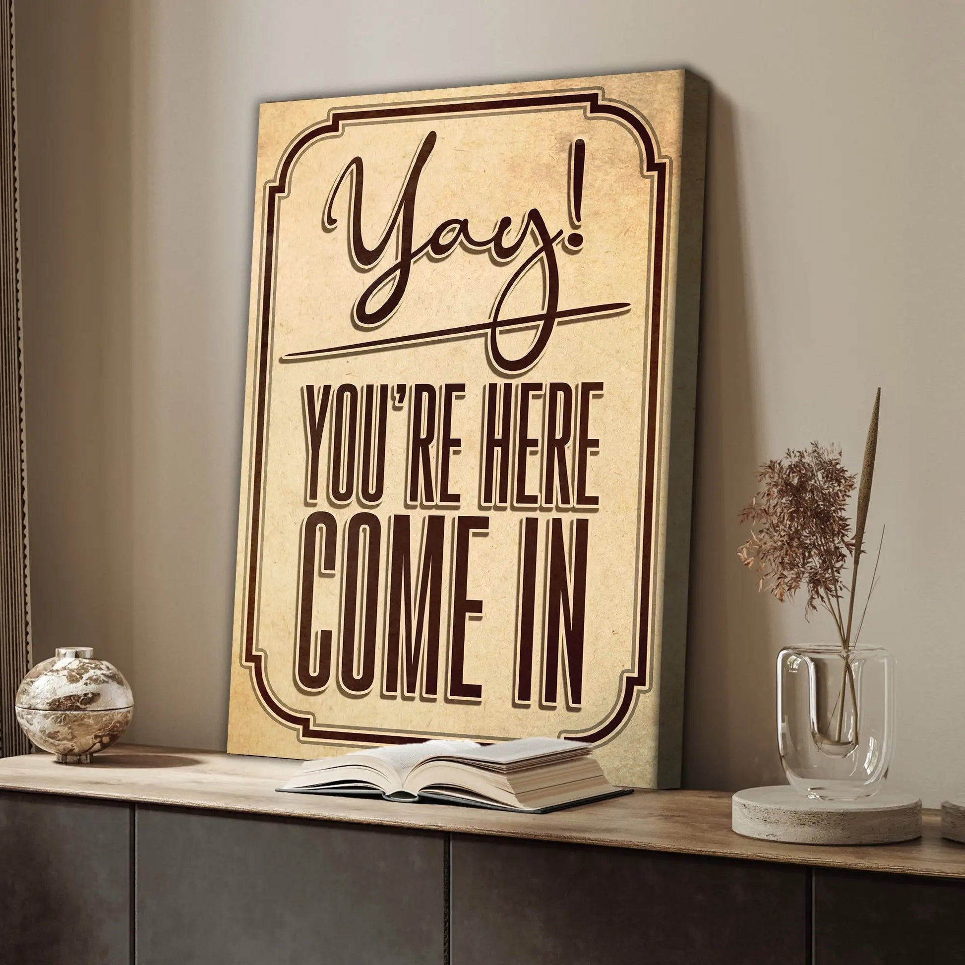 Entryway sign canvas by Tailored Canvases with bold brown script Yay You're Here on Tampa Home & Garden Store