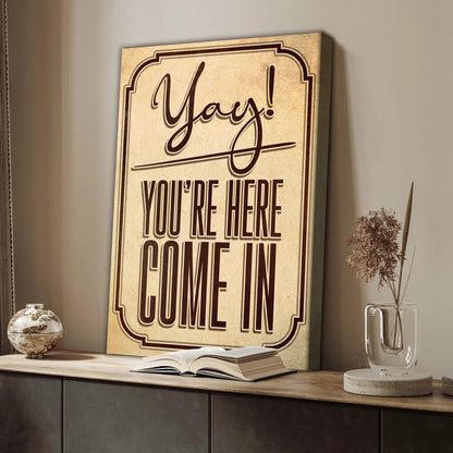 Entryway sign canvas by Tailored Canvases with bold brown script Yay You're Here on Tampa Home & Garden Store
