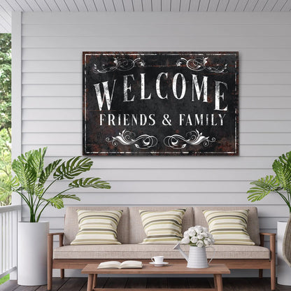 Welcome Friends & Family canvas sign with distressed black background and white ornate scrolls on Tampa Home & Garden Store