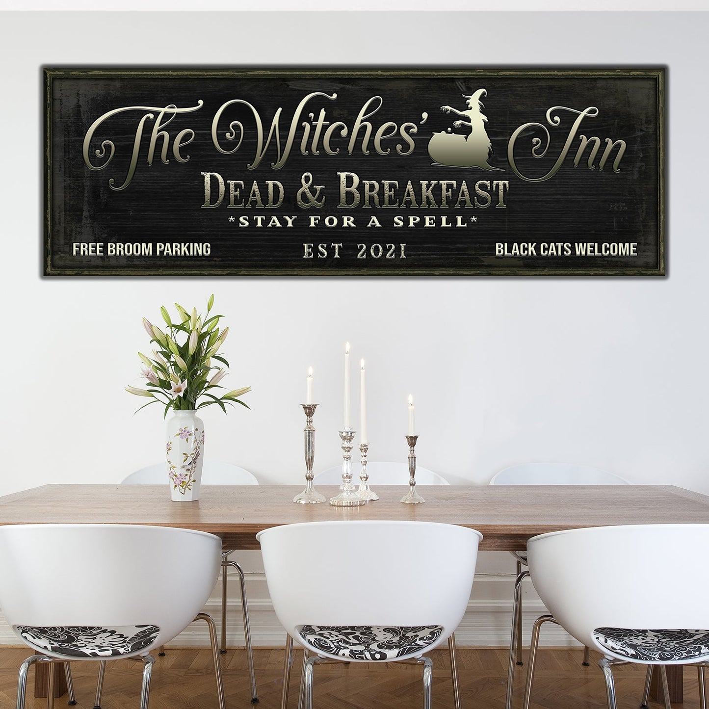 The Witches Inn Sign Crafting Canvas in dark wood frame with gold lettering on Tampa Home & Garden Store