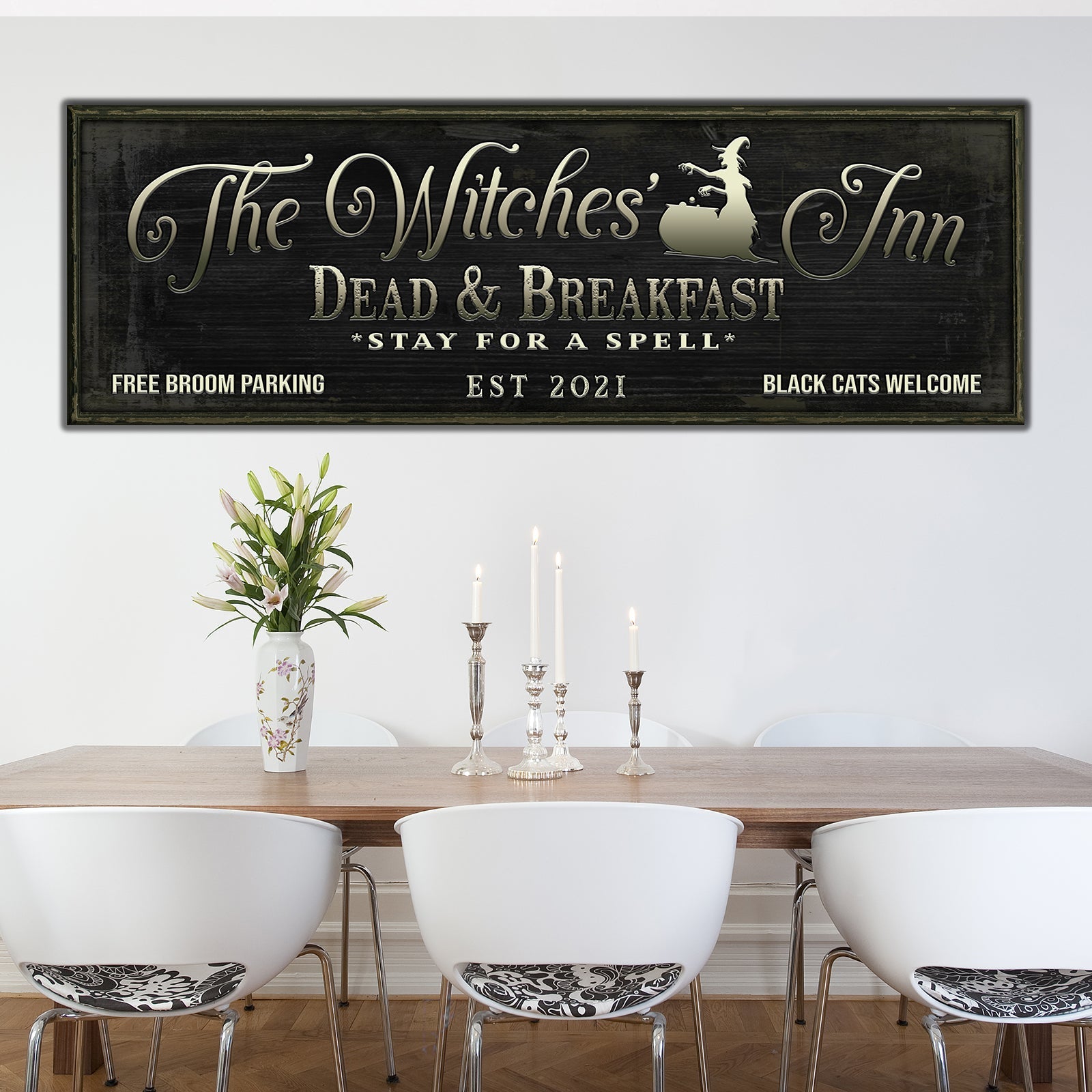 The Witches Inn Sign Crafting Canvas in dark wood frame with gold lettering on Tampa Home & Garden Store