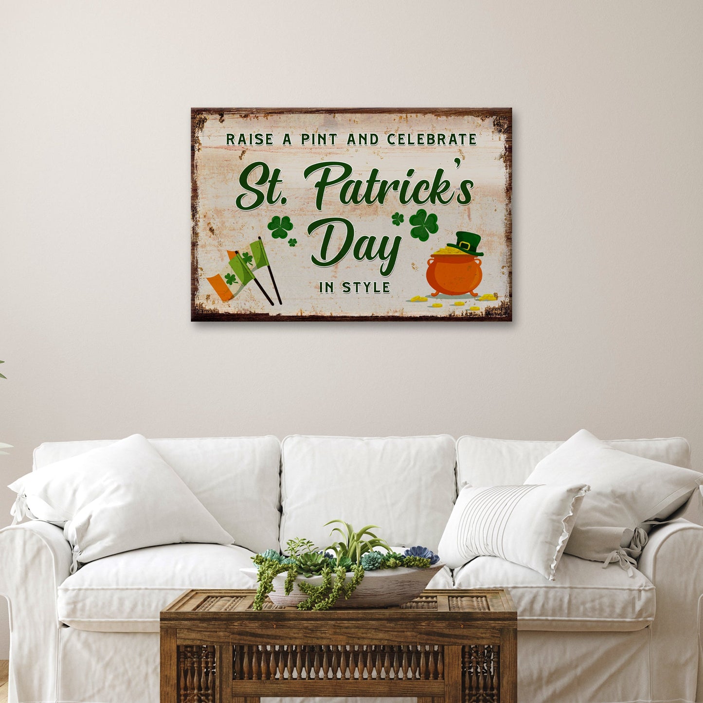 Canvas sign by Tailored Canvases, distressed white background, green St Patrick's Day lettering on Tampa Home & Garden Store