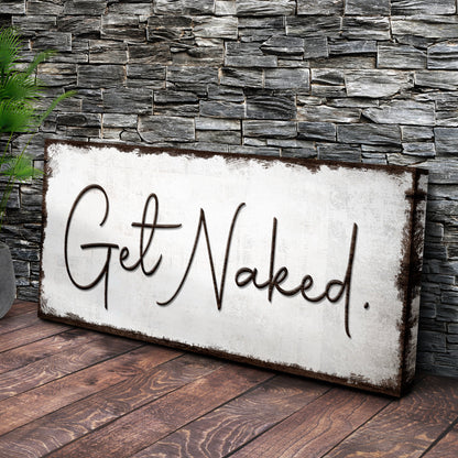 Get Naked bathroom sign canvas by Tailored Canvases, cursive text on white board backdrop on Tampa Home & Garden Store