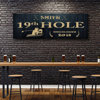 19th Hole sign canvas with gold lettering on dark wood background in a bar setup on Tampa Home & Garden Store