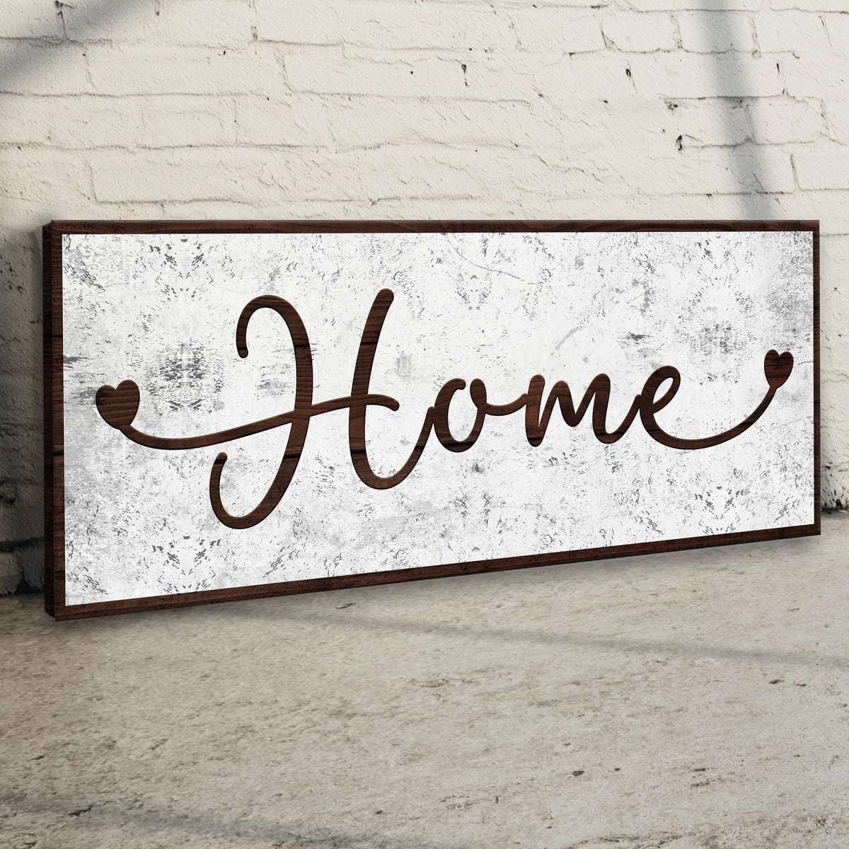 Home Sign II canvas crafting sign with rustic wood frame on whitewashed textured brick backdrop on Tampa Home & Garden Store