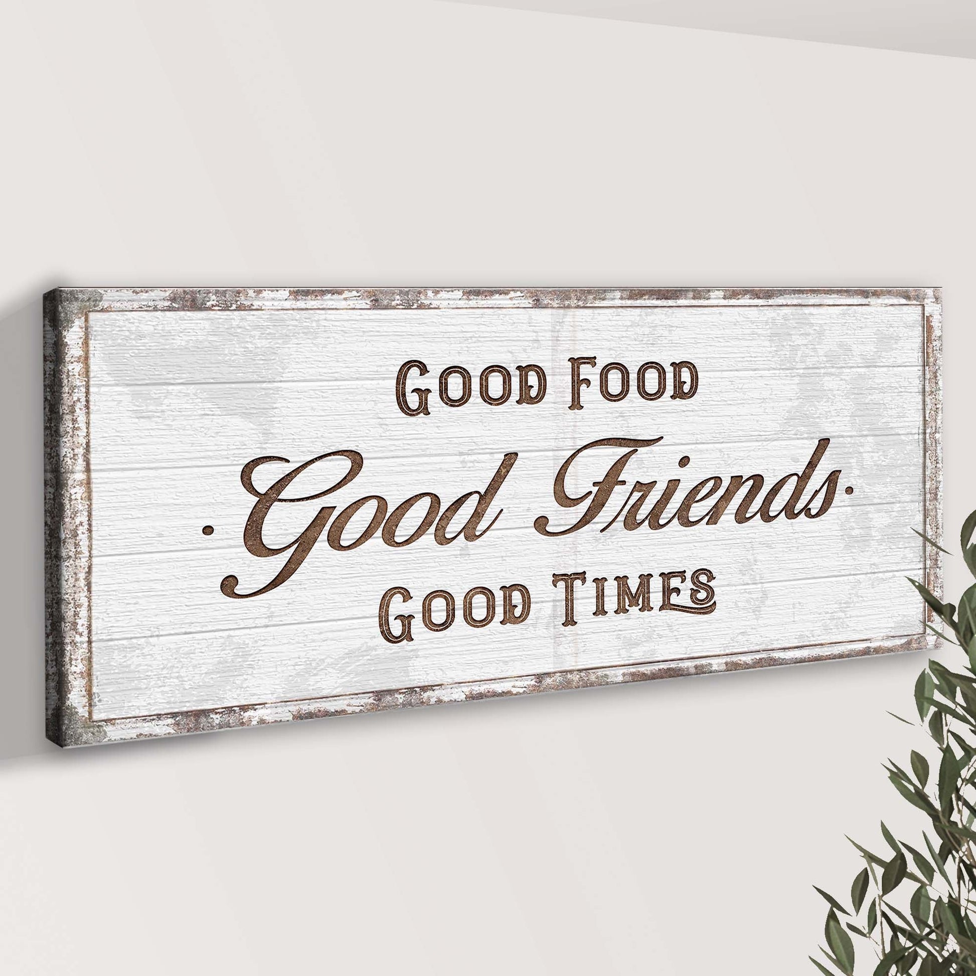 Canvas sign with rustic whitewashed frame reading Good Food Good Friends in vintage script on Tampa Home & Garden Store