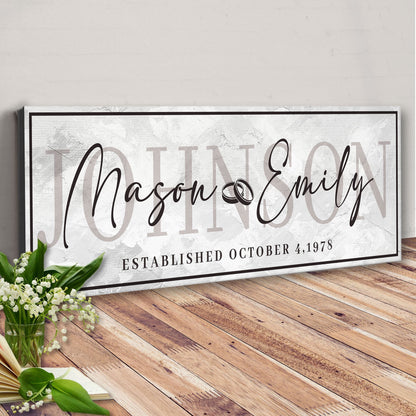 Last Name Wedding Gift Sign canvas with scripted names on backdrop and black border on Tampa Home & Garden Store