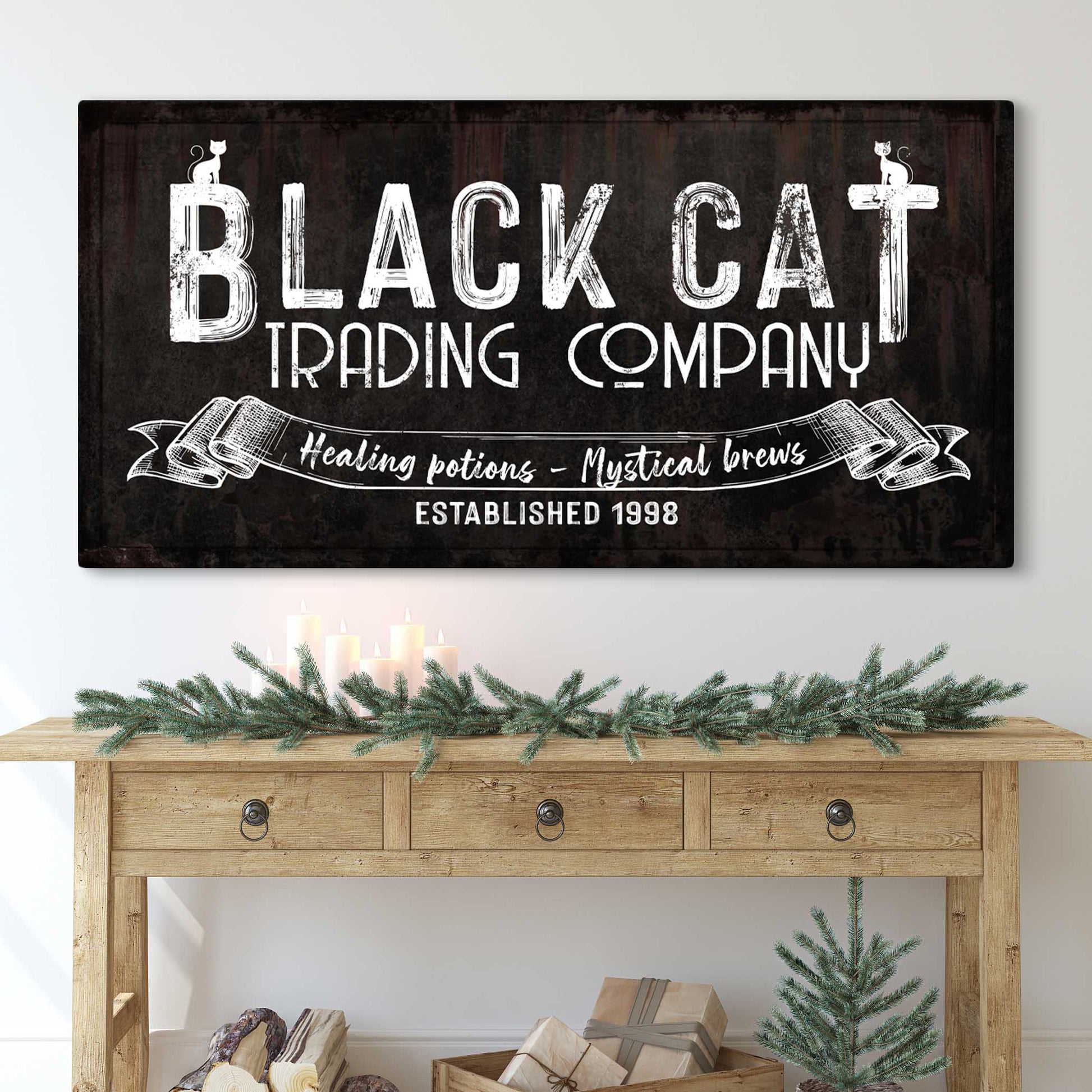 Canvas sign Black Cat Trading Company with distressed white lettering on dark wood on Tampa Home & Garden Store