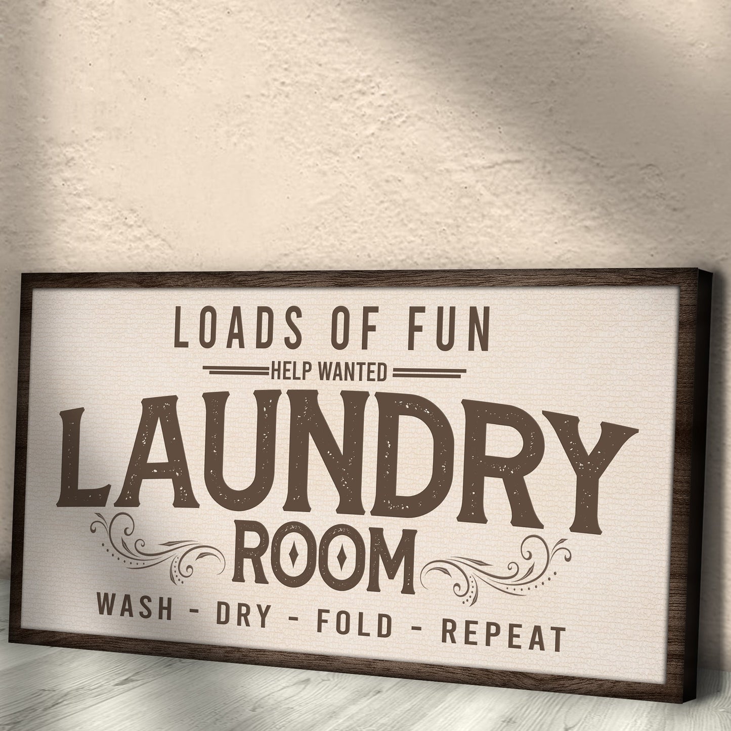 Canvas sign Loads Of Fun Help Wanted Laundry Room with LAUNDRY in a dark wood frame on Tampa Home & Garden Store