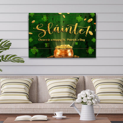 Sláinte St. Patrick's Day canvas sign with gold script, coins, and shamrocks on green background on Tampa Home & Garden Store