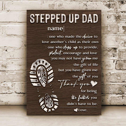 Canvas sign Tailored Canvases with wood grain background featuring STEPPED UP DAD and customizable name on Tampa Home & Garden Store