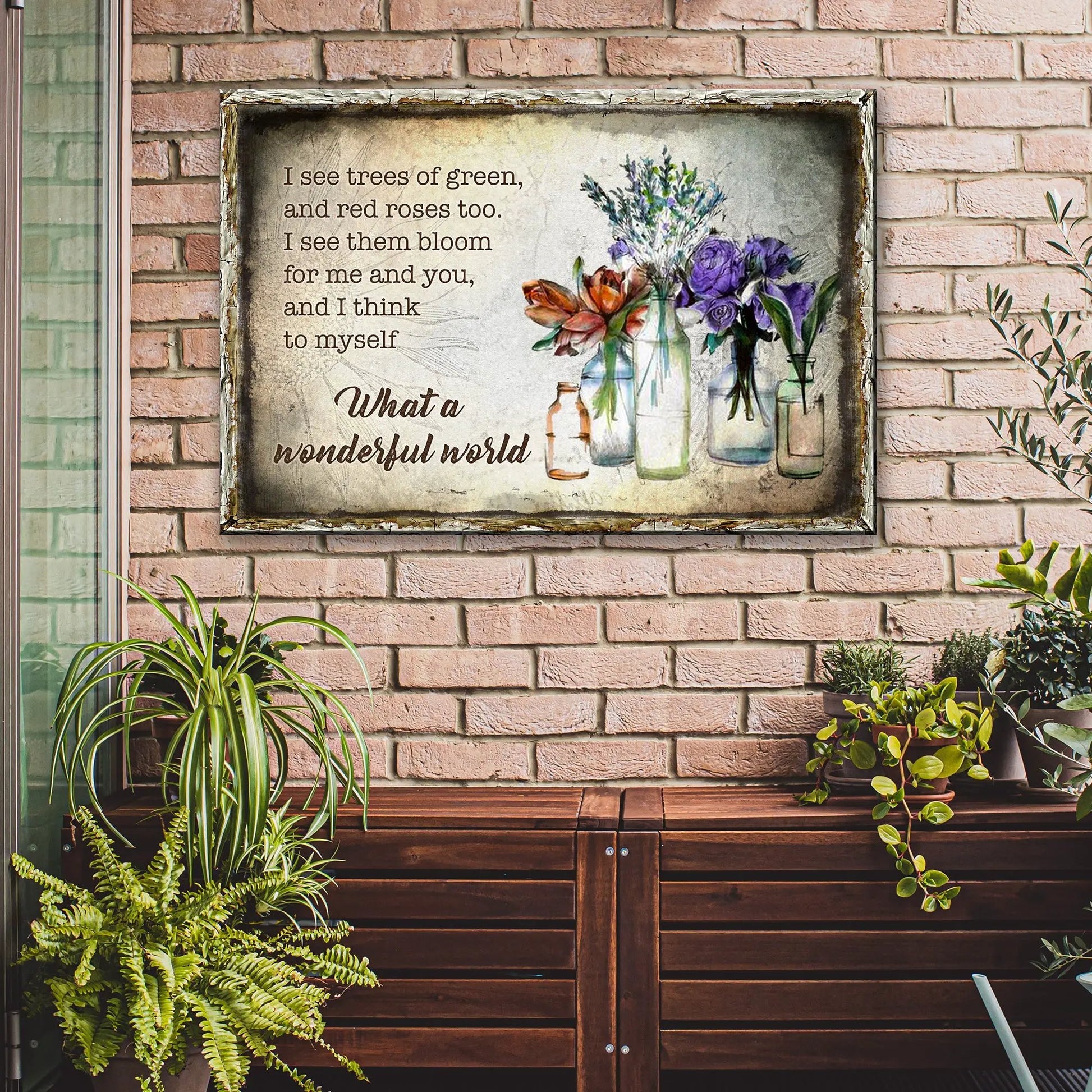What A Wonderful World Sign VIII canvas with rustic framed bouquet artwork on brick wall on Tampa Home & Garden Store