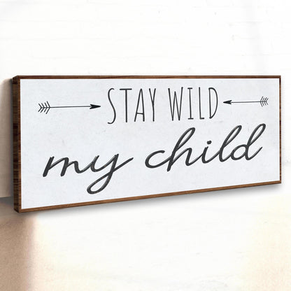 Stay Wild My Child canvas sign by Tailored Canvases, framed wood, black script with arrows on Tampa Home & Garden Store