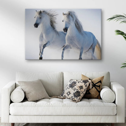 Canvas wall art White Horse Couple by Tailored Canvases; two white horses galloping in a snowy blue backdrop on Tampa Home & Garden Store
