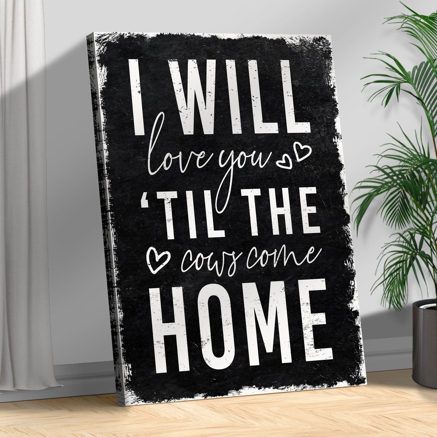 Canvas sign with black background reading I WILL LOVE YOU TIL THE COWS COME HOME on Tampa Home & Garden Store
