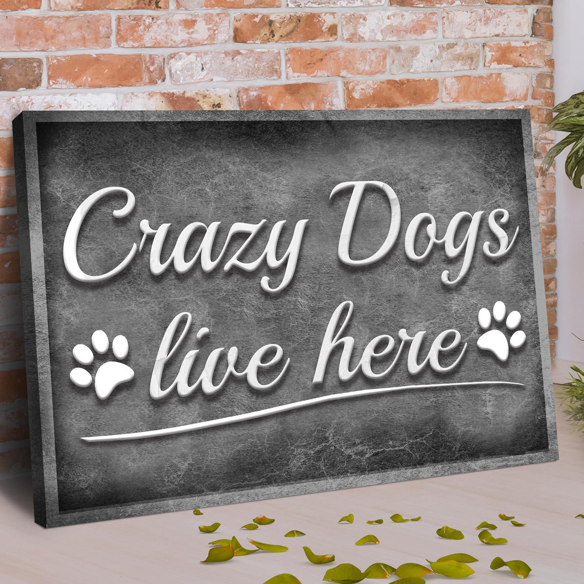 Canvas sign Crazy Dogs Live Here II by Tailored Canvases, dark panel with white script paw prints on Tampa Home & Garden Store