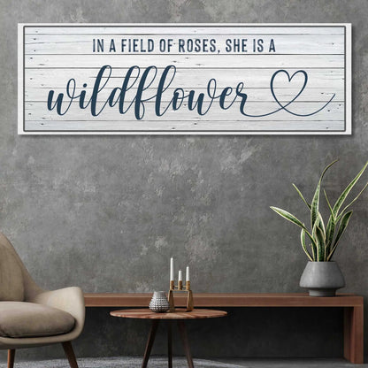 Canvas sign She Is A Wildflower Sign II with whitewashed wood background and navy script on Tampa Home & Garden Store