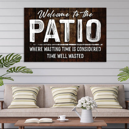 Welcome Patio Sign canvas by Tailored Canvases on dark wood with white distressed lettering on Tampa Home & Garden Store