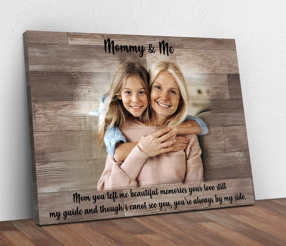 A Mother's Memory Sign canvas on wood backdrop shows a mother and daughter hug with Mommy & Me on Tampa Home & Garden Store
