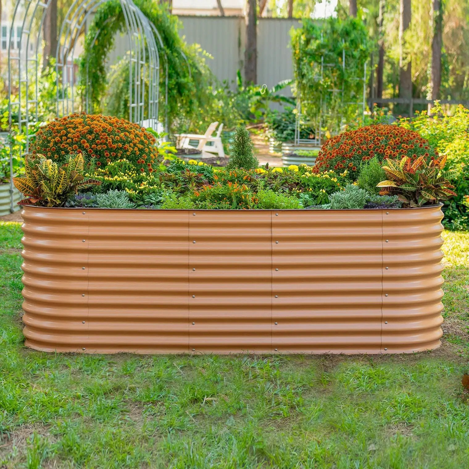 Vego Garden 32 inch 4x8 raised bed with orange mums and lush greens in tan corrugated planter on Tampa Home & Garden Store