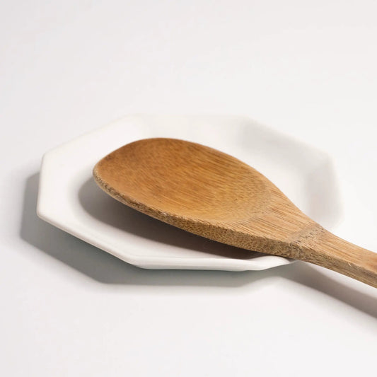 Handmade porcelain spoon rest with wooden spoon on white ceramic dish on Tampa Home & Garden Store