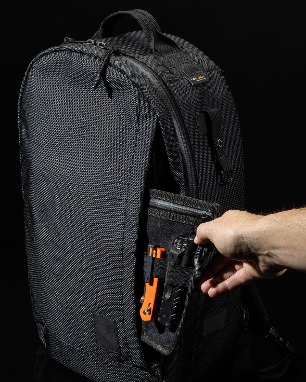 Conceal Pack 21L backpack black Cordura fabric by The Brown Buffalo with side tool pocket on Tampa Home & Garden Store