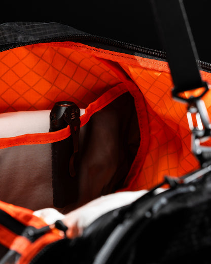 Duffalo duffel bag with orange interior lining and black exterior by The Brown Buffalo on Tampa Home & Garden Store