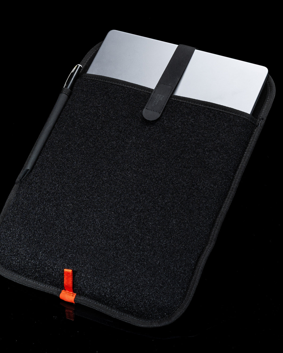 Laptop Sleeve black textured fabric with orange pull tab and strap by The Brown Buffalo on Tampa Home & Garden Store