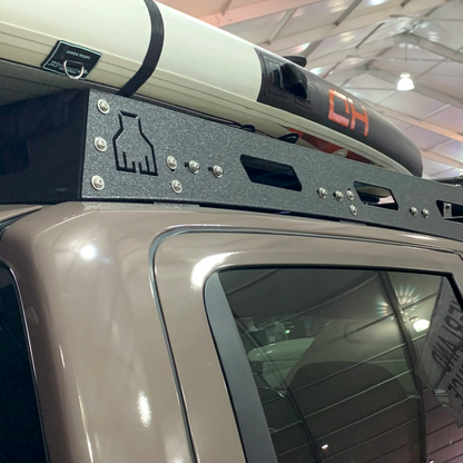 Nissan Titan Roof Rack by Avatar Offroad, black textured steel carrying a white kayak on Tampa Home & Garden Store