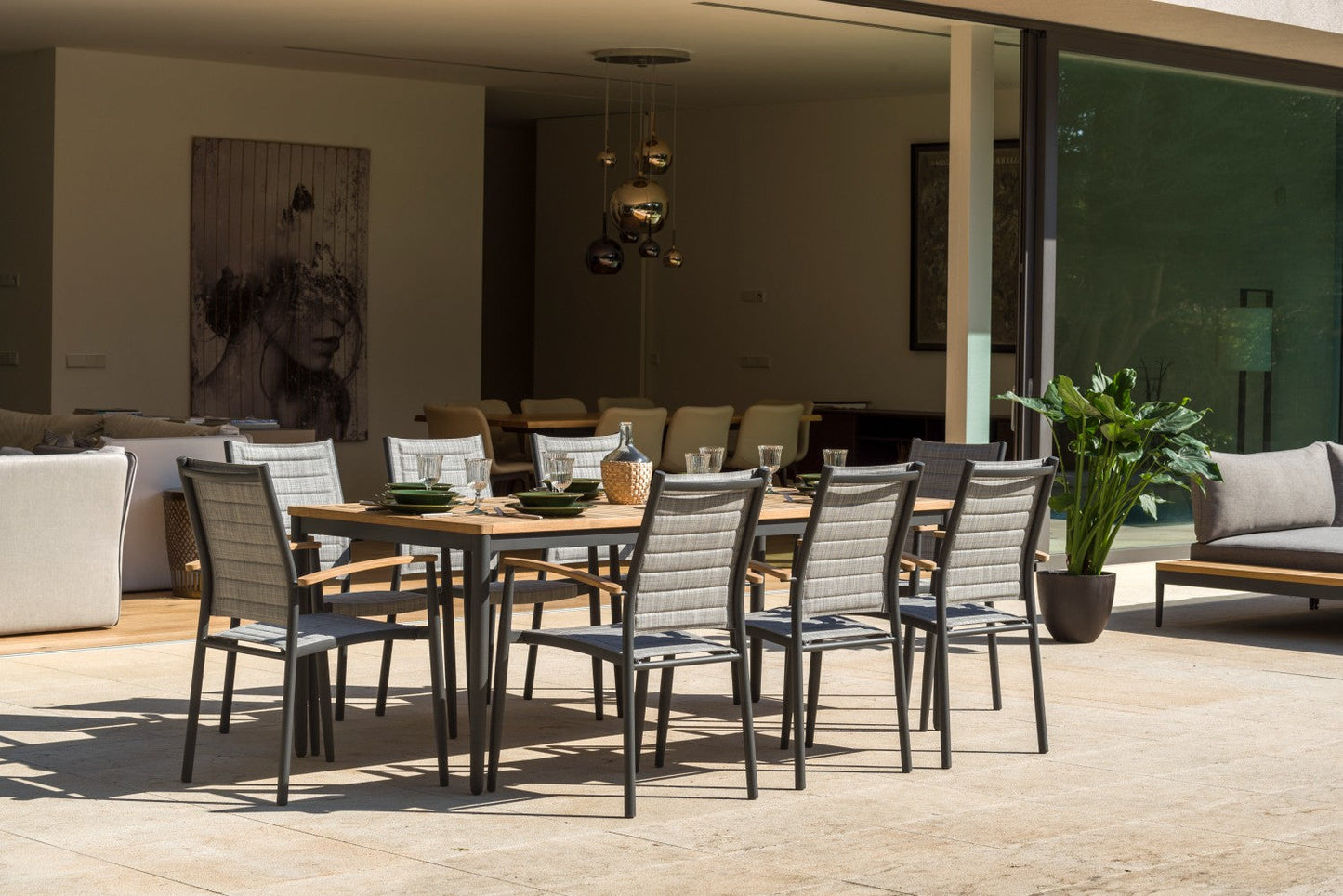 Topaz 9-Piece Teak Big Rectangular Outdoor Dining Set with gray woven chairs on Tampa Home & Garden Store