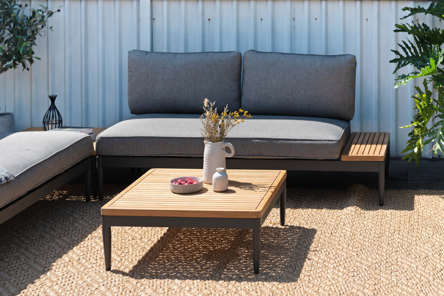 Topaz 2 Seater Sofa and chaise in gray outdoor fabric with wooden coffee table on Tampa Home & Garden Store