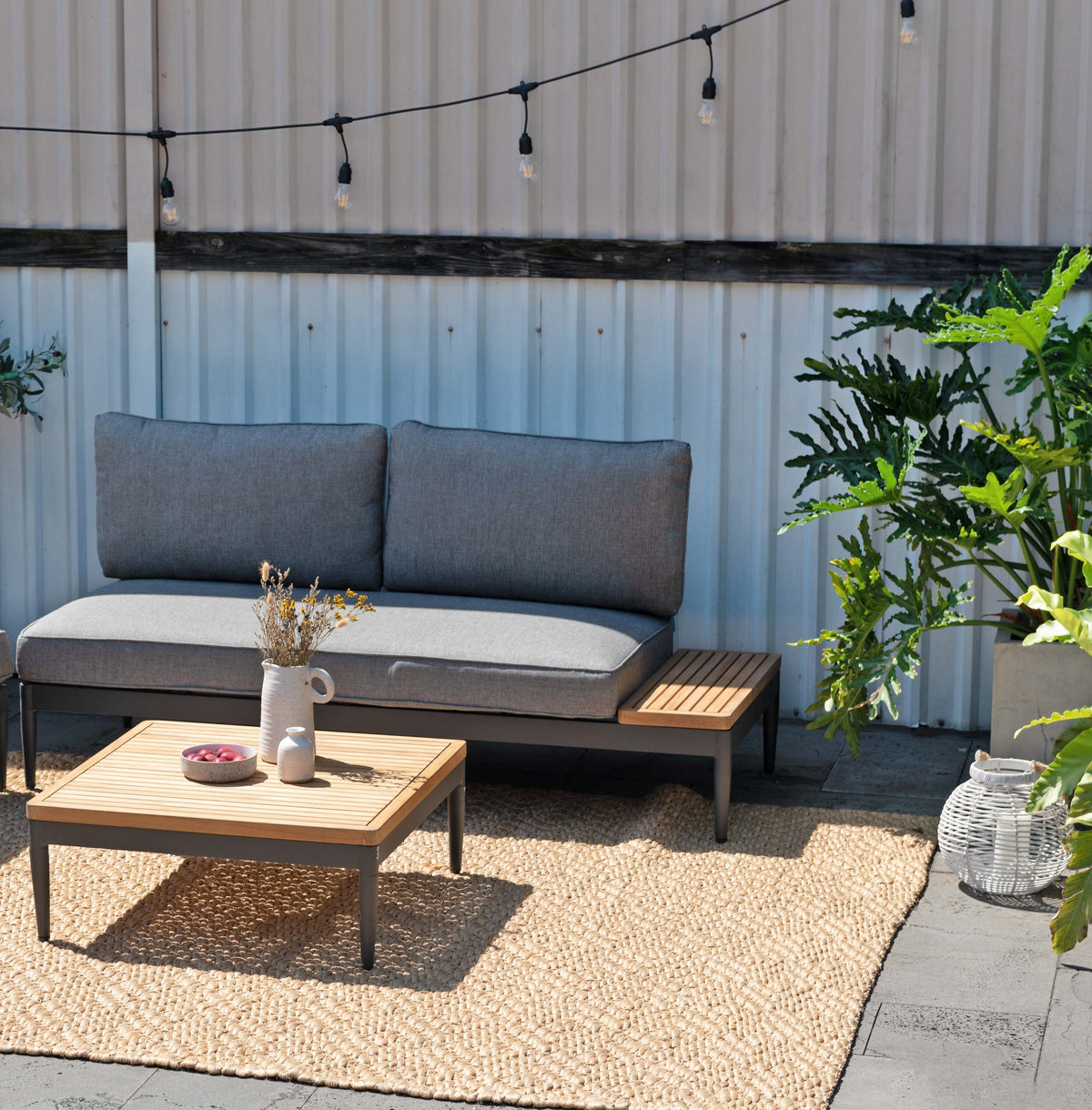 Topaz 2pc Seating Set LifestyleGarden US outdoor sofa with gray cushions on a jute rug on Tampa Home & Garden Store