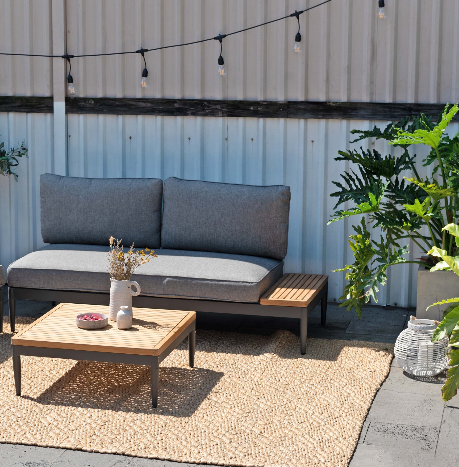 Topaz 2pc Seating Set LifestyleGarden US outdoor sofa with gray cushions on a jute rug on Tampa Home & Garden Store