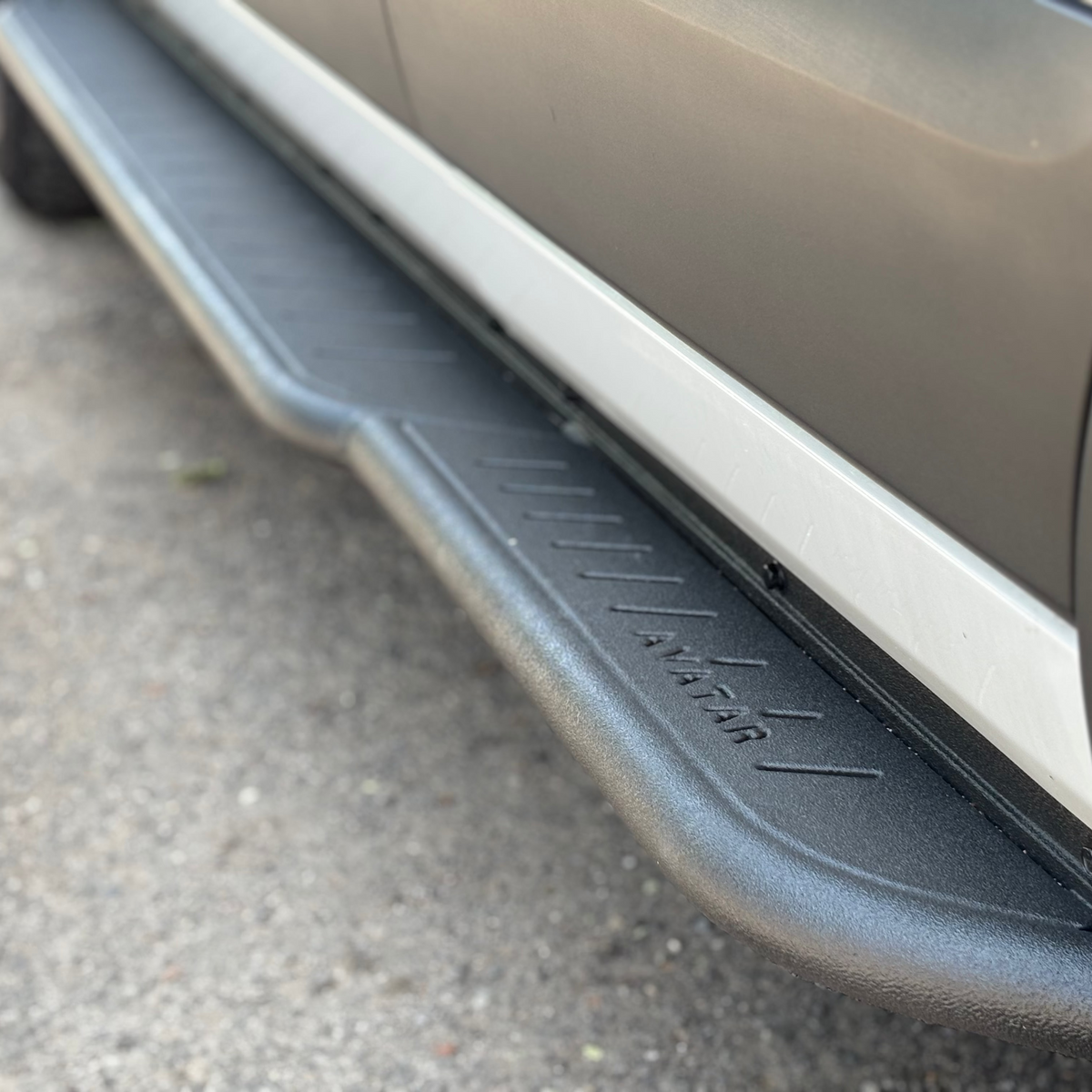 Avatar Ford Transit Rockbody side steps in metallic silver along van rocker panel on Tampa Home & Garden Store