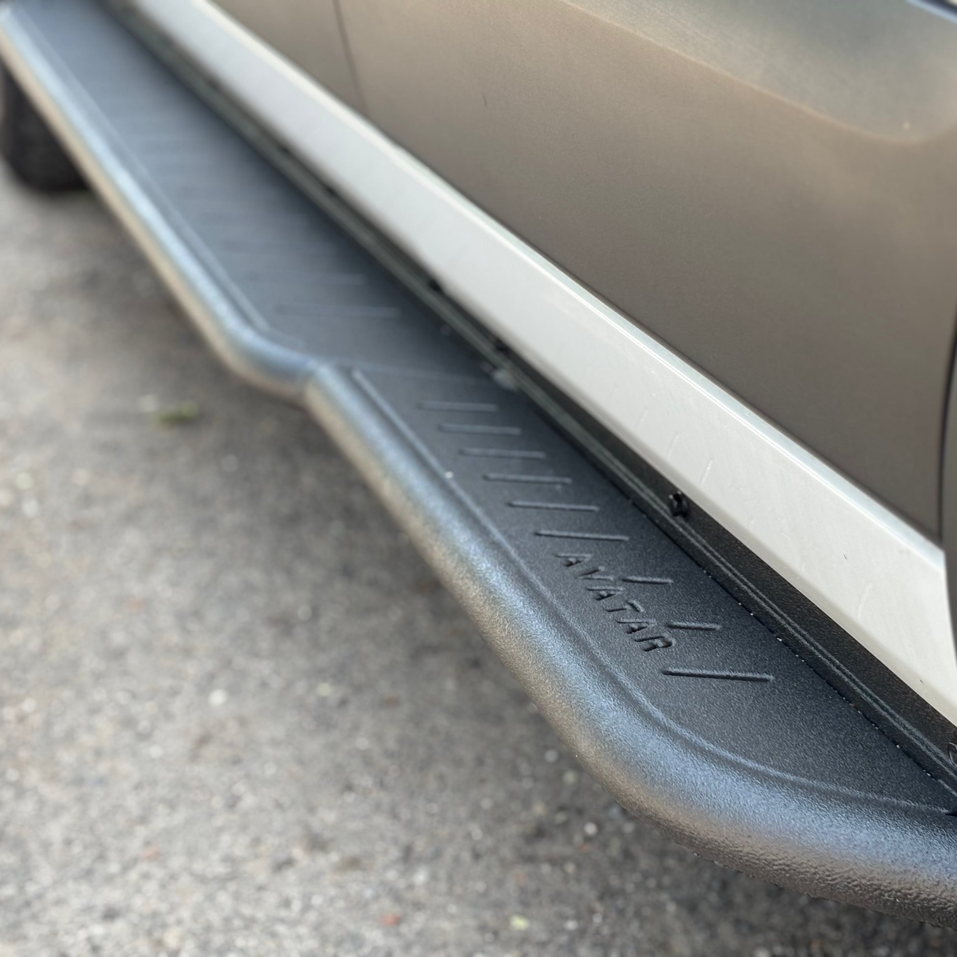 Avatar Ford Transit Rockbody side steps in metallic silver along van rocker panel on Tampa Home & Garden Store