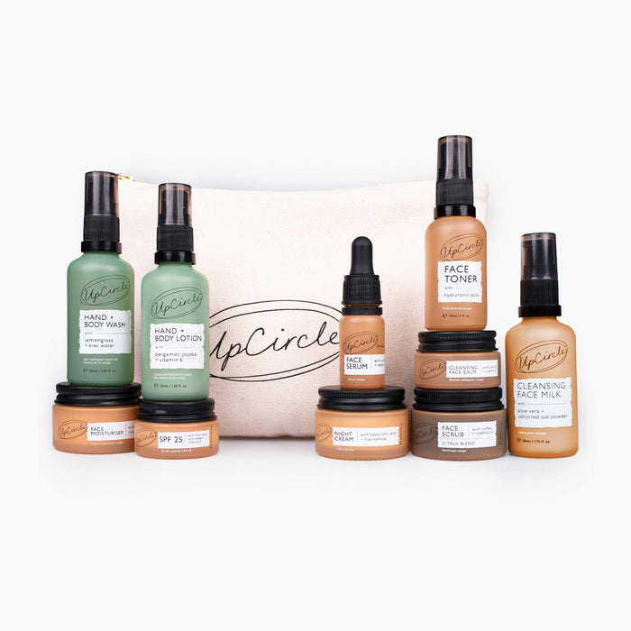 UpCircle Travel-Size Skincare Bundle gift set with green and tan travel bottles in a beige pouch on Tampa Home & Garden Store