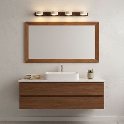 Travertine stone wall sconce with dimmable LED on a natural wood bar above a wooden mirror on Tampa Home & Garden Store