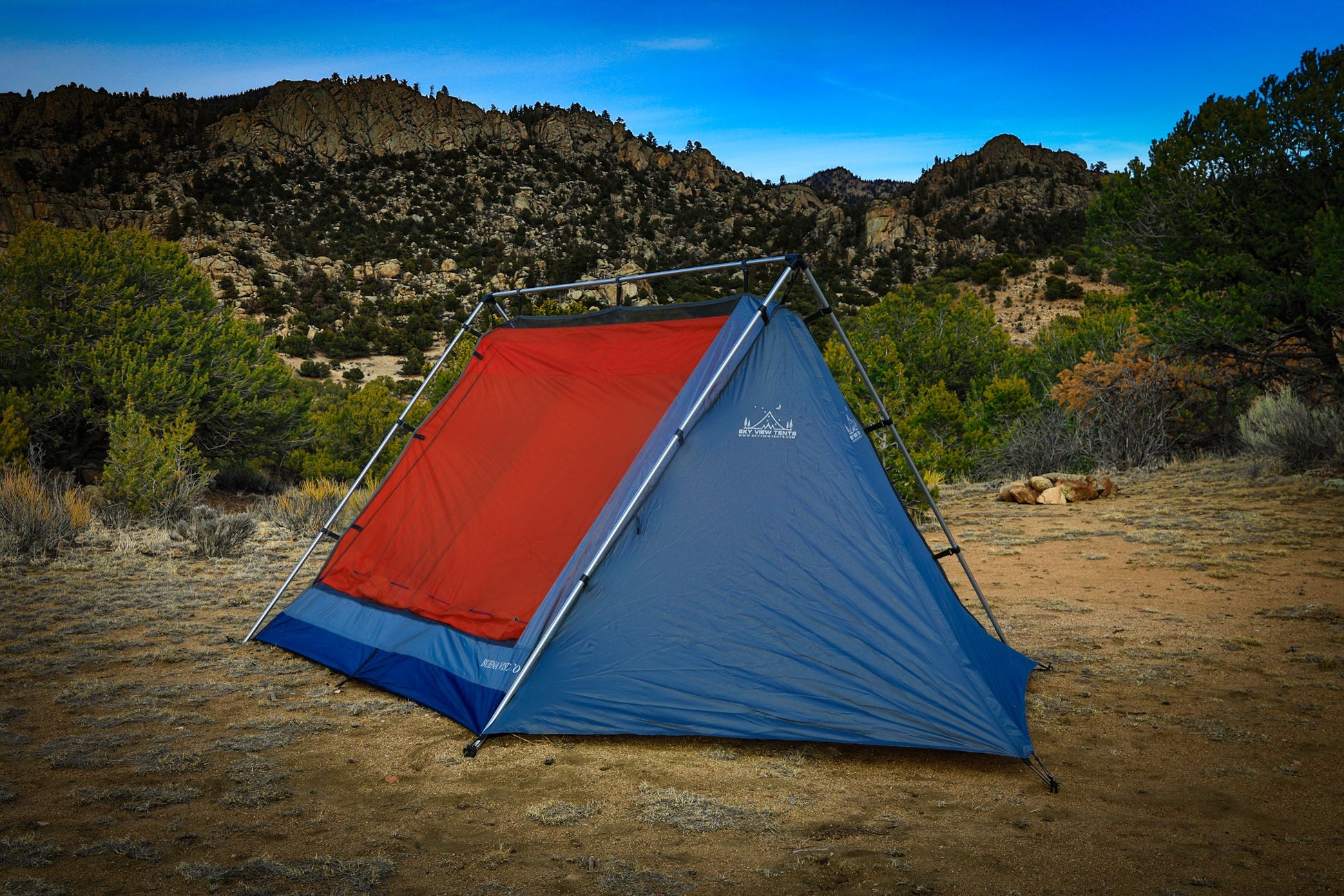 Sky View XL Tent blue and orange pitched in a rocky desert canyon with metal frame Sky View Tents on Tampa Home & Garden Store