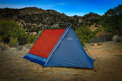 Sky View XL Tent blue and orange pitched in a rocky desert canyon with metal frame Sky View Tents on Tampa Home & Garden Store