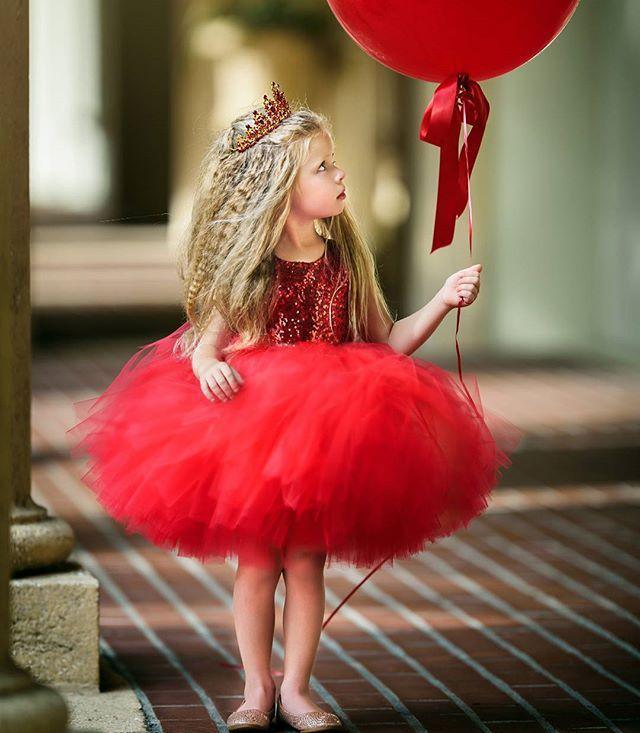 Stevvex baby girl red sequin dress with tulle skirt, crown headband, holding red balloon on Tampa Home & Garden Store
