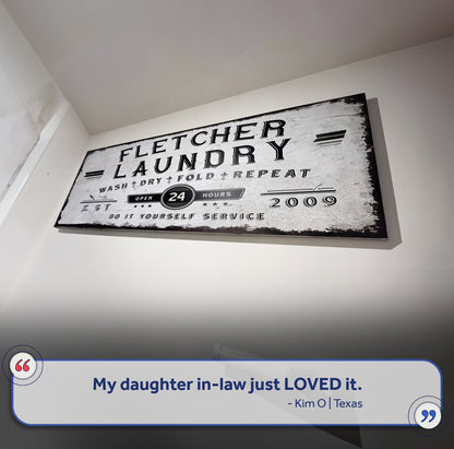 Personalized laundry room sign canvas with distressed black lettering on white background on Tampa Home & Garden Store