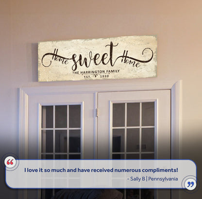 Home Sweet Home canvas sign with distressed beige background and vintage script above a doorway on Tampa Home & Garden Store