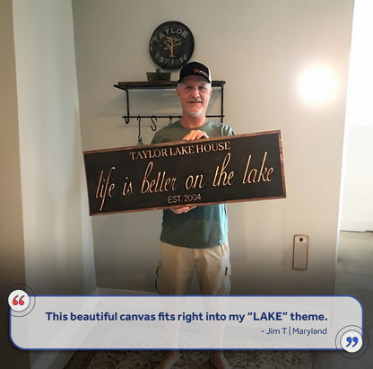 Life Is Better On The Lake sign canvas by Tailored Canvases held by a man on Tampa Home & Garden Store