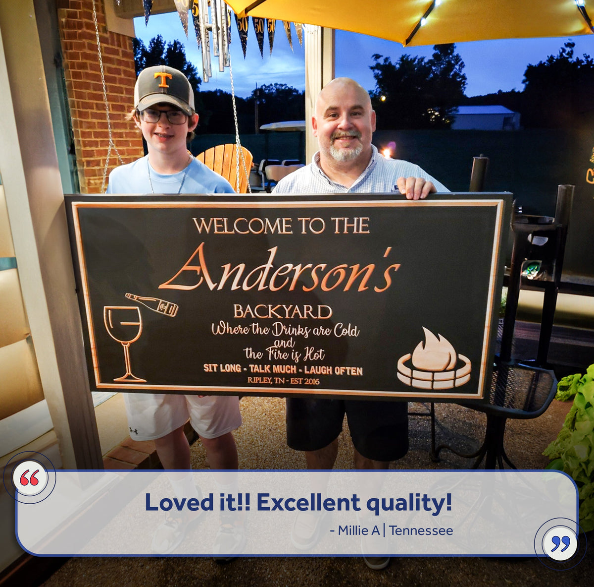 Backyard Sign canvas by Tailored Canvases with Anderson's text, held by two people on Tampa Home & Garden Store
